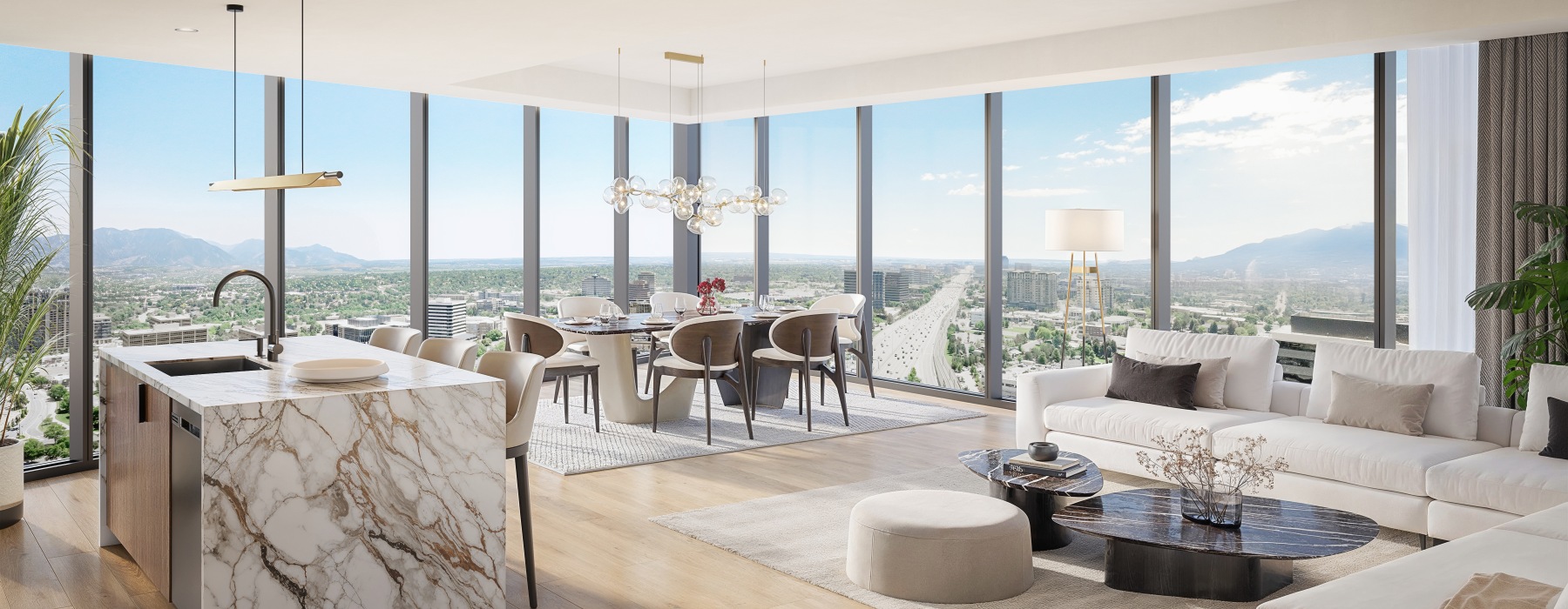 Open furnished kitchen, living room, and dining area in a 3 bedroom apartment in Denver at Apiary.